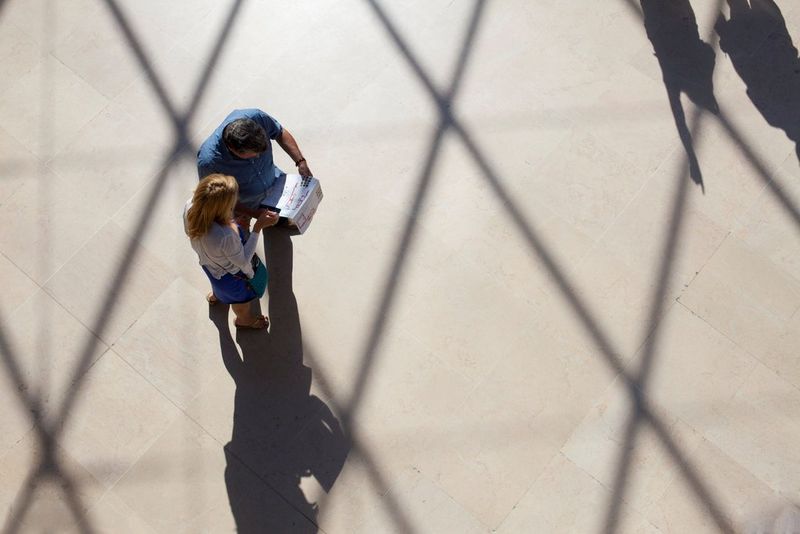  Man and woman looking at paper